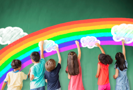 Children painting a rainbow with clouds on a wall.